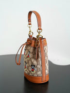 COACH - Disney Mini Dempsey Bucket Bag In Signature Jacquard Mickey Mouse