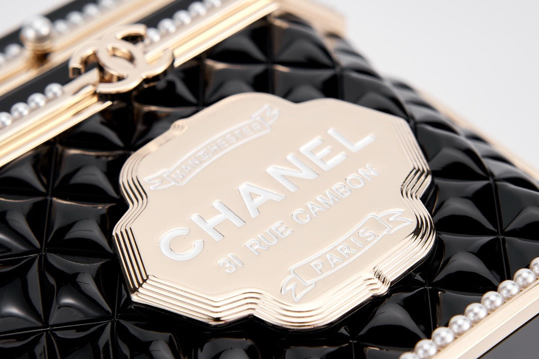 CHANEL - Limited Edition Black Quilted Resin Tea Box Minaudiere Imitation Pearl and Gold Hardware, 2024