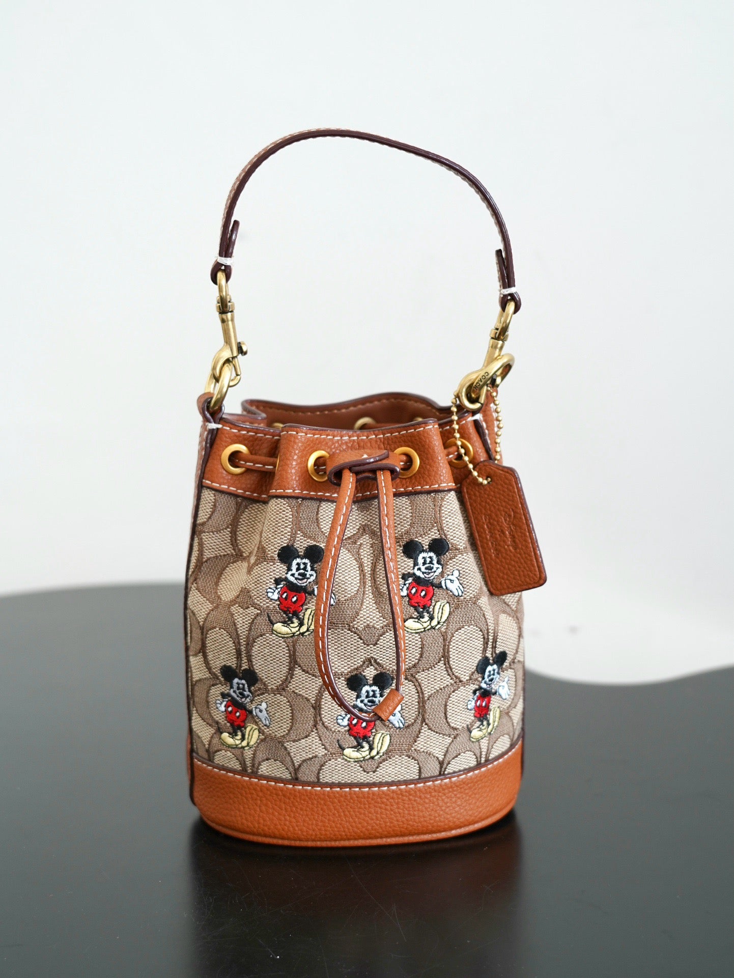 COACH - Disney Mini Dempsey Bucket Bag In Signature Jacquard Mickey Mouse