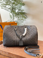 LOUIS VUITTON- Keepall Bandouliere 50