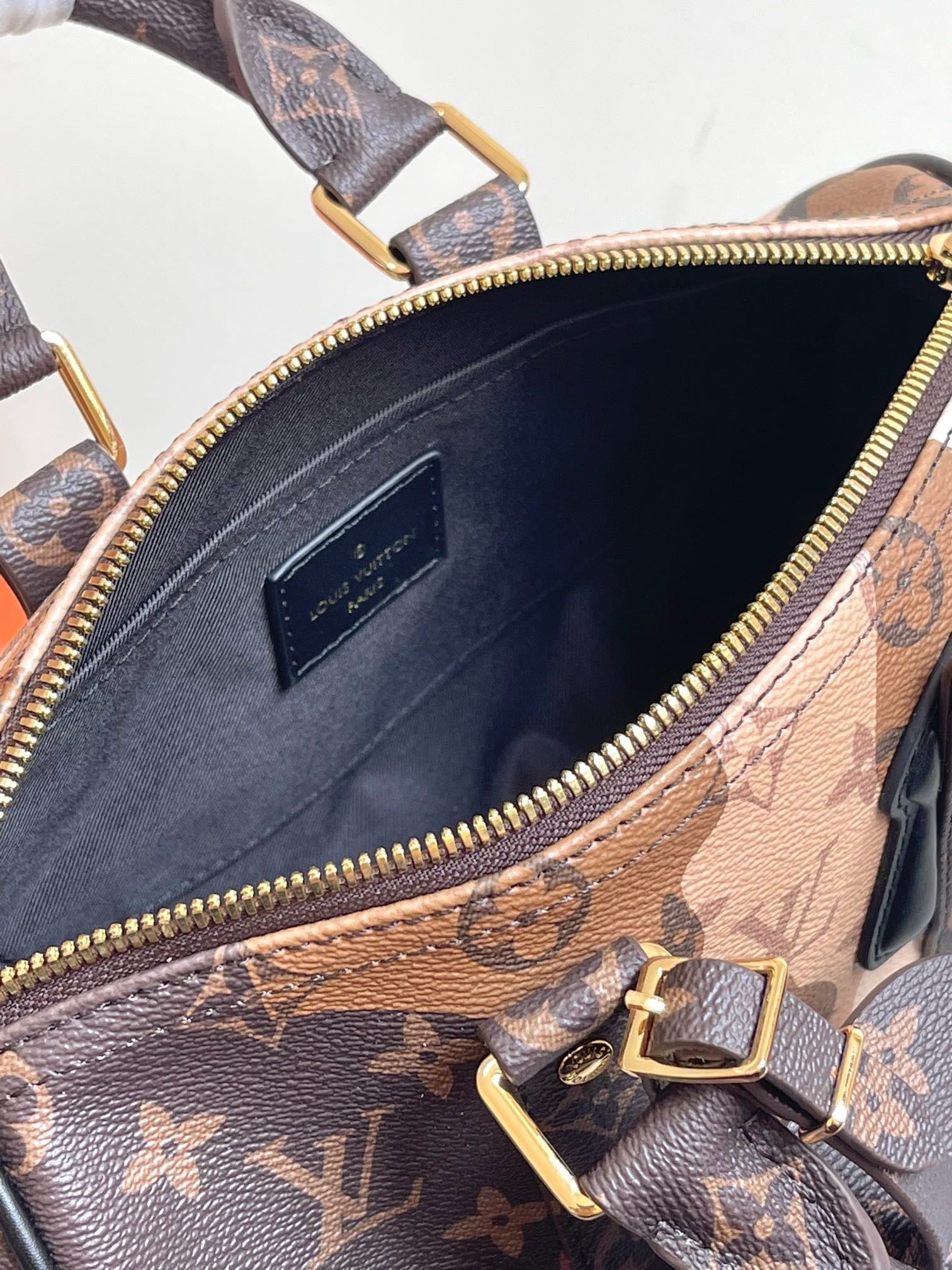 LOUIS VUITTON - Monogram Portrait Keepall Bandouliere 25 Brown