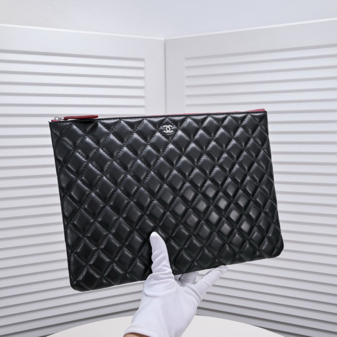 CHANEL - Lambskin O Case clutch bag