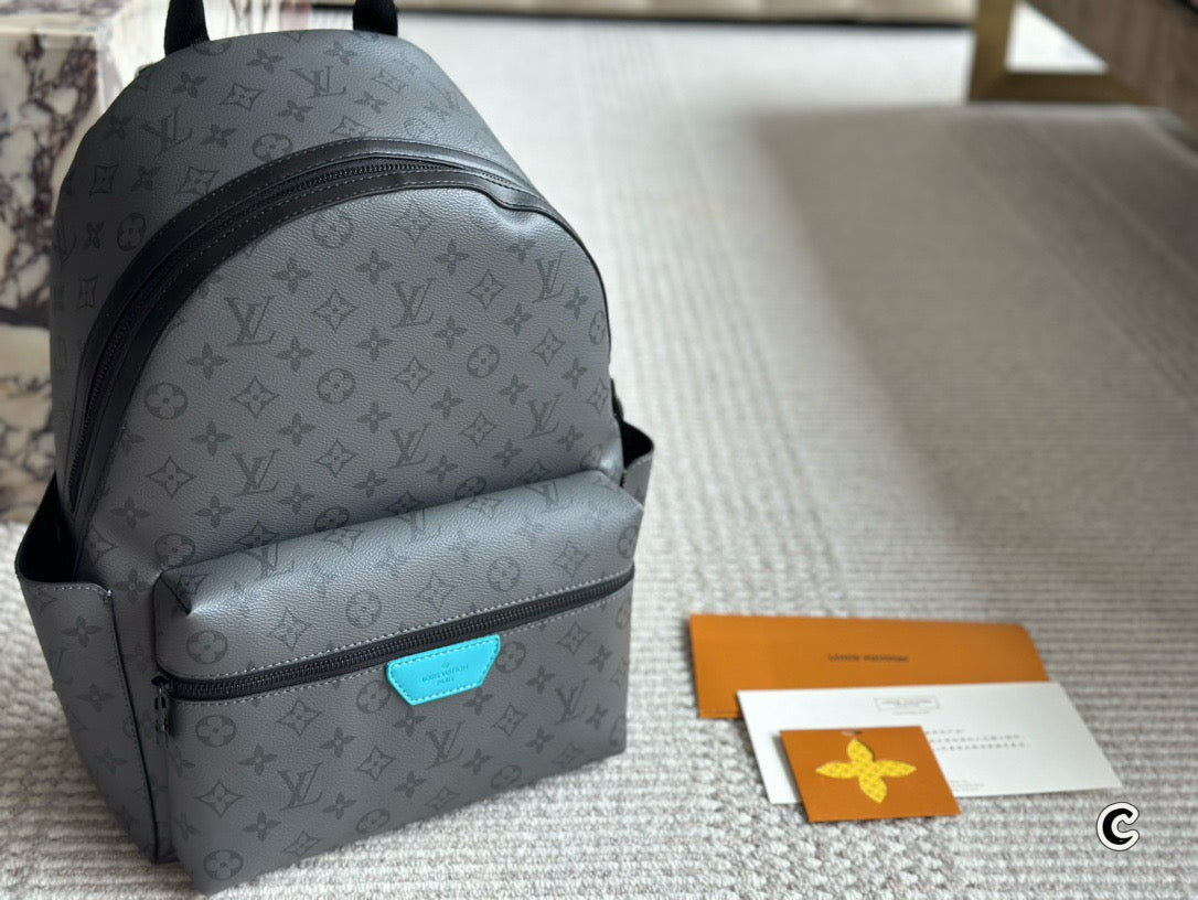 LOUIS VUITTON- Discovery Backpack PM