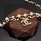 CHANEL - A FAUX PEARL CC BRACELET