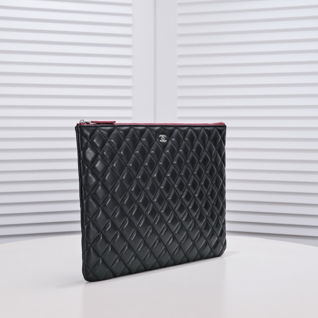 CHANEL - Lambskin O Case clutch bag
