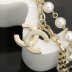 CHANEL - A FAUX PEARL CC BRACELET