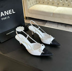 CHANEL - Vintage Iconic "CC" White & Black Toe Cap Slingback Heels