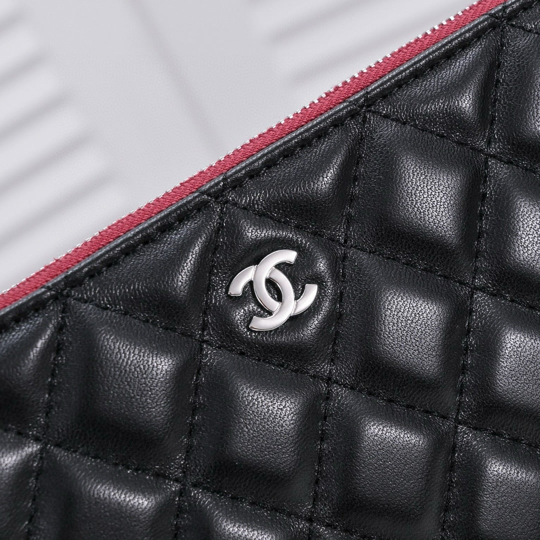 CHANEL - Lambskin O Case clutch bag