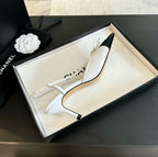 CHANEL - Vintage Iconic "CC" White & Black Toe Cap Slingback Heels
