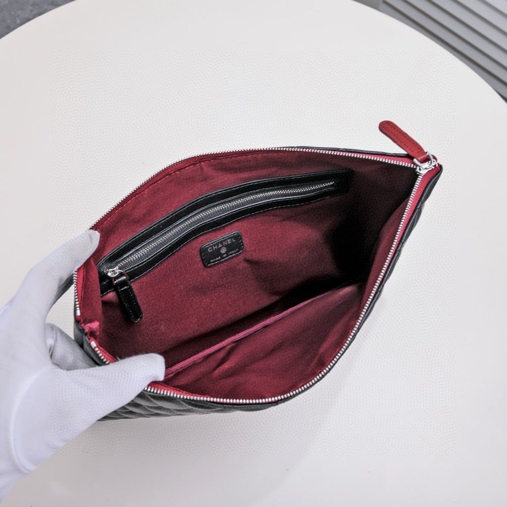 CHANEL - Lambskin O Case clutch bag