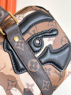 LOUIS VUITTON - Monogram Portrait Keepall Bandouliere 25 Brown