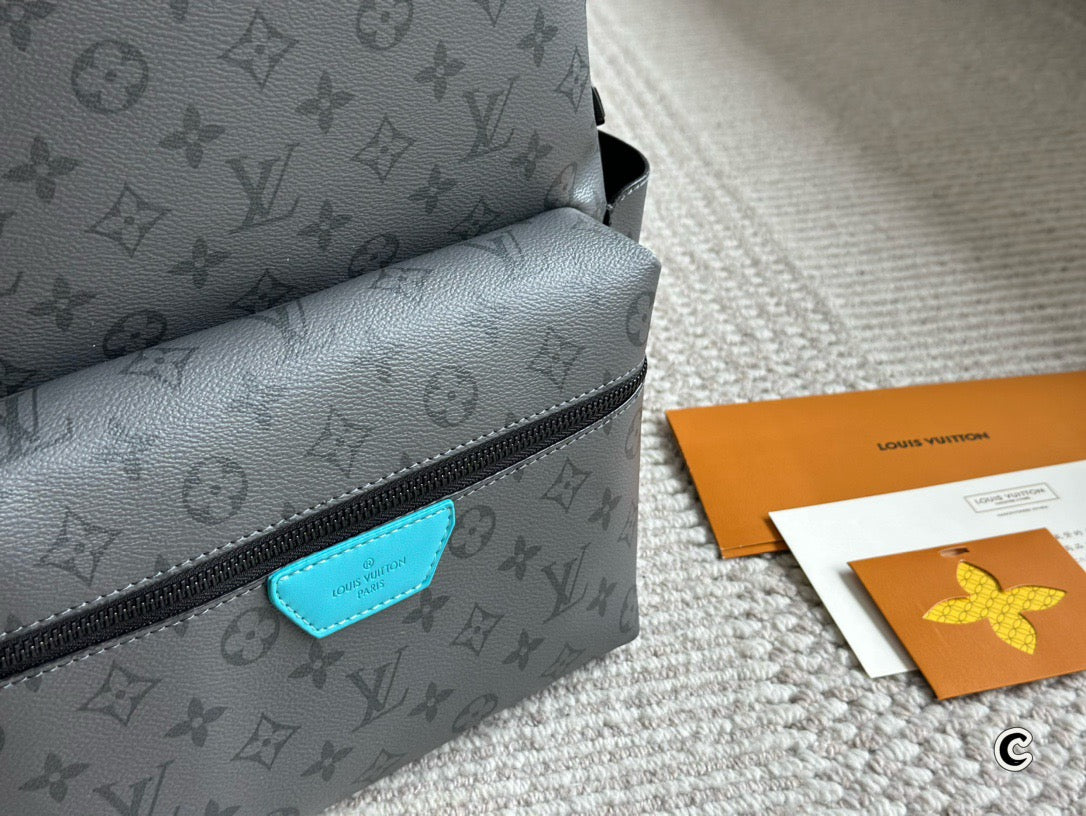 LOUIS VUITTON- Discovery Backpack PM